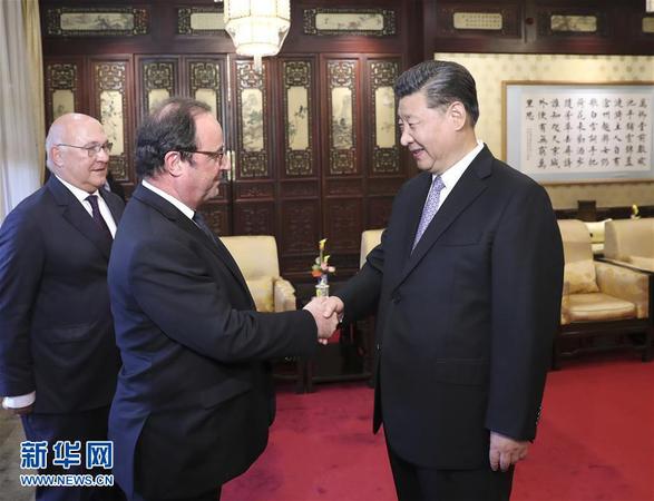5月25日，国家主席习近平在北京钓鱼台国宾馆会见法国前总统奥朗德。新华社记者 庞兴雷 摄