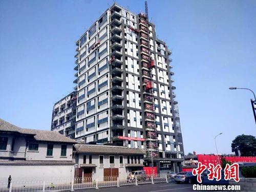 正在修建的楼房。<a target='_blank' href='http://www.chinanews.com/' >中新网</a>记者 李金磊 摄 正在修建的楼房。<a target='_blank' href='http://www.chinanews.com/' >中新网</a>记者 李金磊 摄
