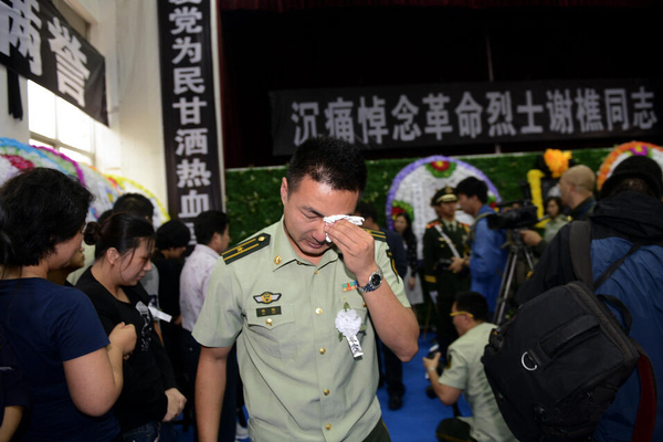 追悼会现场，谢樵生前的战友。