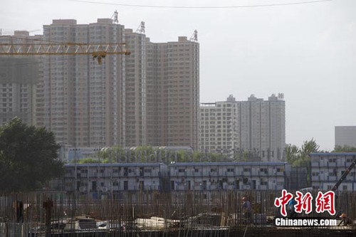 中国调低非限购市首套房首付比例 释放稳楼市信号