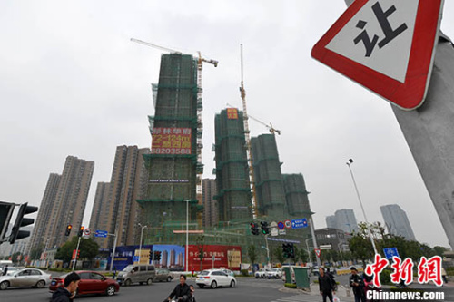 资料图：商品房建设。 <a target='_blank' href='http://www.chinanews.com/'>中新社</a>记者 吕明 摄