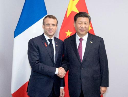 ——会见法国总统马克龙，强调要坚定维护多边主义，加强在气候变化、世界贸易组织改革、伊朗核等重大国际问题上的沟通协调。