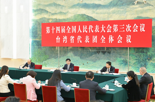 3月7日下午，中共中央政治局常委、全国政协主席王沪宁参加十四届全国人大三次会议台湾代表团审议。新华社记者 高洁 摄